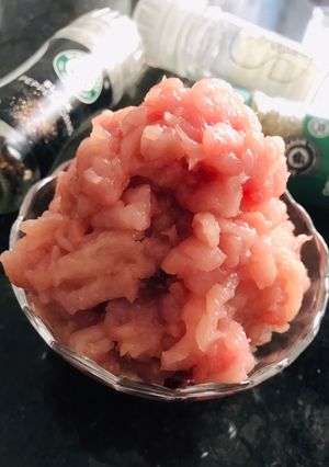 A picture of Homemade Ground Chicken (with a knife).