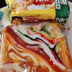 A picture of Parle-G Biscuits Brownie with Mirror Glaze Effect.