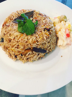 A picture of Vangi bath (brinjal rice).