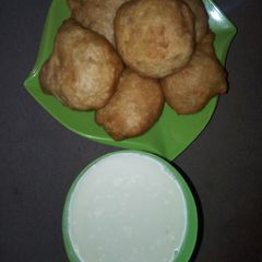 A picture of Puff puff and hot chocolate.