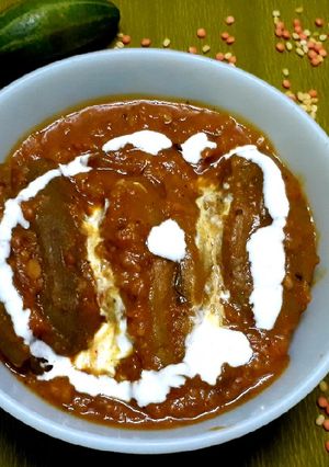 A picture of Potoler dolma pointed gourd with spicy filling.