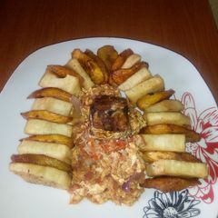 A picture of Fried Yam/Ripe plantain,egg sauce and fried mackerel fish.