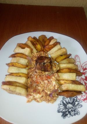 A picture of Fried Yam/Ripe plantain,egg sauce and fried mackerel fish.