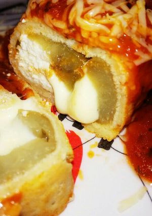 Una foto de Canelones de berenjena, ricota y queso