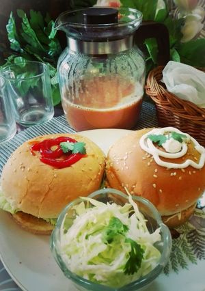 A picture of Chicken Burger with Tea.