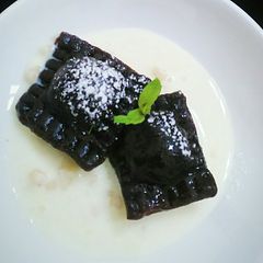 A picture of Chocolate Ravioli with Khoya Filling.
