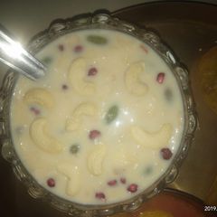 A picture of Mix fruit and dryfruit custard.