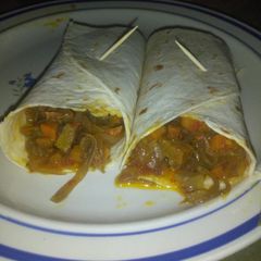 A picture of Tortilla with beef and vegetable sauce.