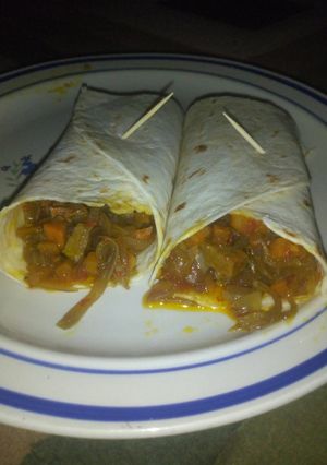 A picture of Tortilla with beef and vegetable sauce.