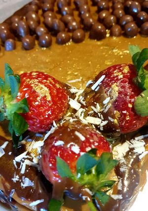A picture of Chocolate and Caramel Cake with delicious add ons.