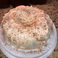 A picture of Spice Cake topped with Cream Cheese Icing and Cinnamon.