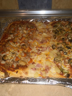 Una foto de Pizza estilo genovesa tricolor