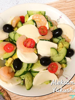A picture of Cucumber Salad with Avocado, Shrimp and Mozzarella.