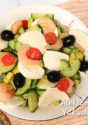 A picture of Cucumber Salad with Avocado, Shrimp and Mozzarella.