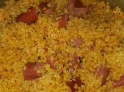Una foto de sofrito de cebolla tomate