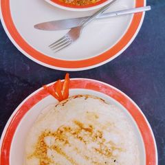 A picture of Sinasir with spinach soup.