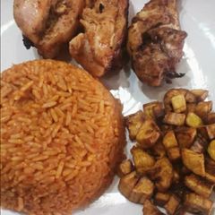 A picture of Jollof rice,fried dodo and fried chicken.