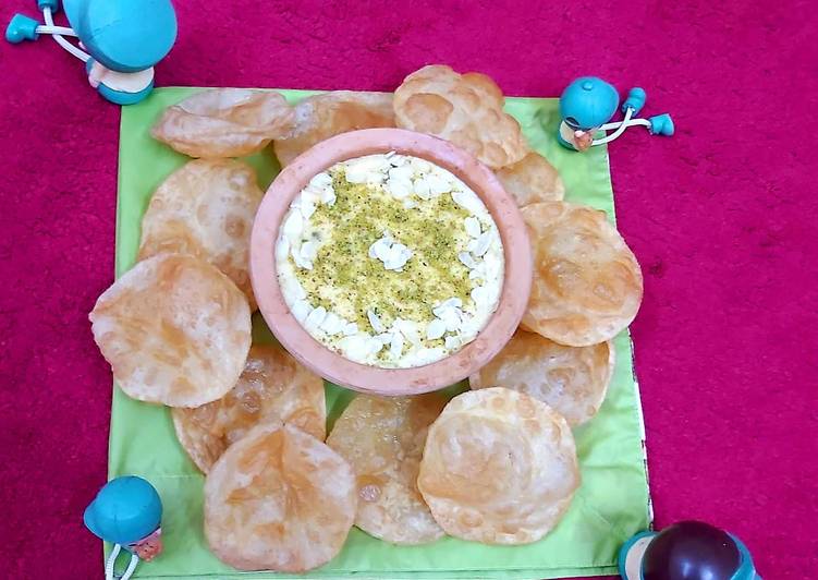 Rice kheer with soft and fluffy puris