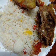 A picture of Chicken stew and vegetable rice.
