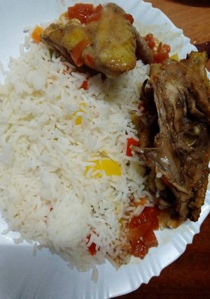 A picture of Chicken stew and vegetable rice.