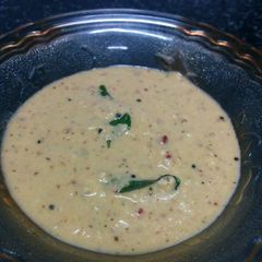 A picture of Red Coconut chutney with curd.