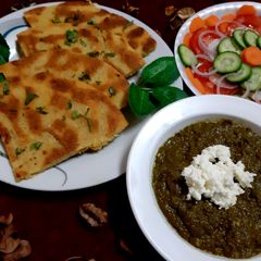 A picture of Sarso ka saag and makai ki roti.