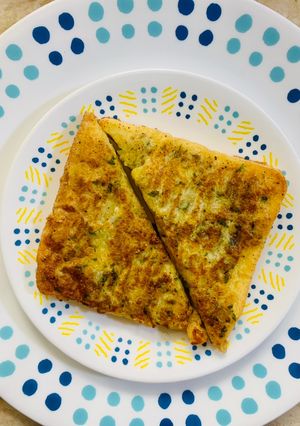 A picture of Pan fried opened Potato Sandwich.