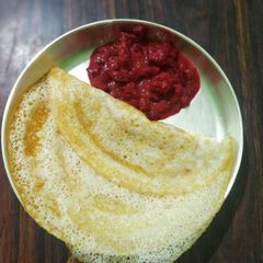 A picture of Tender coconut dosa with beetroot saagu.