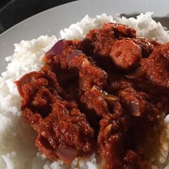 A picture of Basmati rice and sausage sauce.