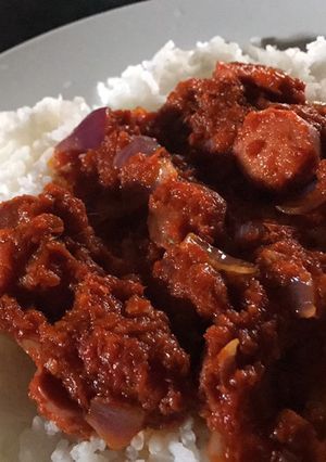 A picture of Basmati rice and sausage sauce.