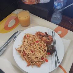 A picture of Spaghetti stir fry with prawns.