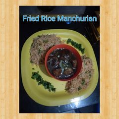 A picture of Veg manchurian and fried rice.