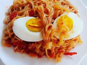 A picture of indomie noodle with fried egg