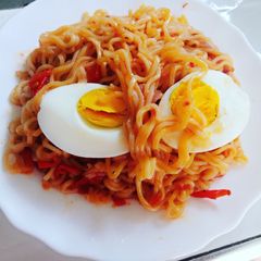 A picture of Fried Indomie with Kienyeji eggs.
