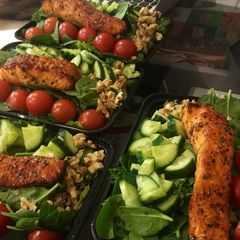 A picture of Mixed leaf and nut salmon salad.