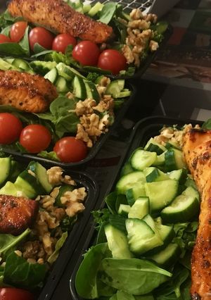 A picture of Mixed leaf and nut salmon salad.
