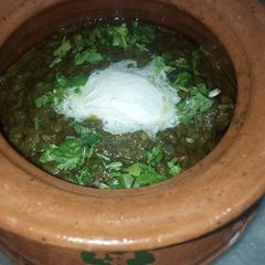 A picture of Sarson Ka saag chicken.