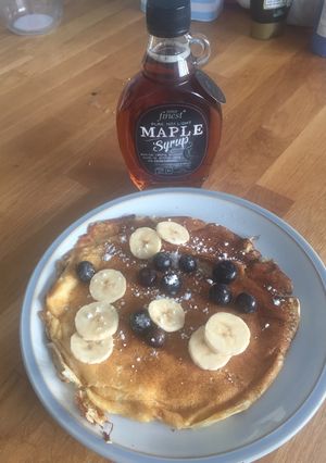 A picture of Big Messy Loaded American-Style breakfast pancakes.