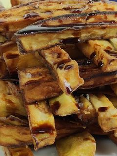Una foto de Torre de berenjenas fritas con miel de caña deliciosas 🍆