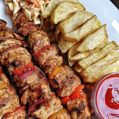 A picture of Juicy chicken skewers/mshikakis.