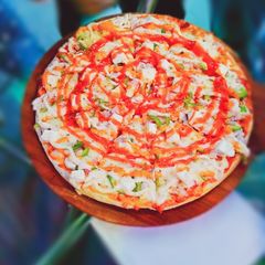 A picture of Homemade paneer cheesy Pizzaa 🍕.