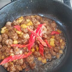 A picture of Sauteé potato and beef.