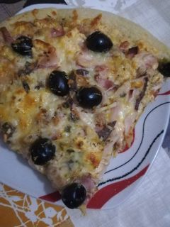 Una foto de Pizza con queso de las finas hierbas en la panicadora del Lidl