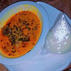 A picture of Tuwon couscous and egusi soup.