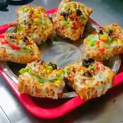 A picture of Cheese garlic toast with  vegetables recipe  on tawa.