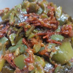 A picture of Tomato with chillies.