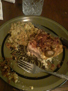 A picture of Parmesan crusted pork chops w/bacon bits and garlic mushrooms.