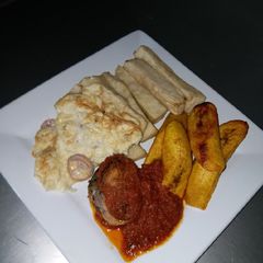 A picture of Fried Yam, Dodo, Omelet and Fish Stew.