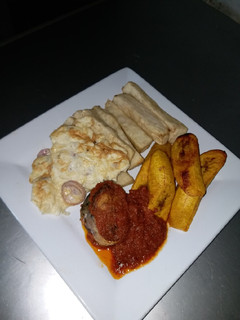 A picture of Fried Yam, Dodo, Omelet and Fish Stew.
