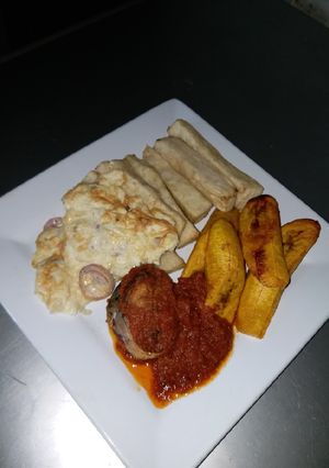 A picture of Fried Yam, Dodo, Omelet and Fish Stew.
